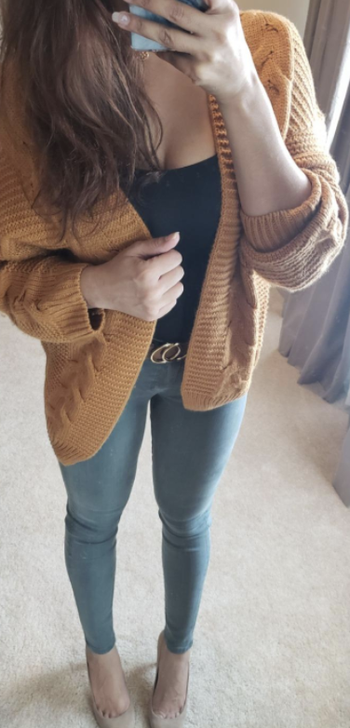 Daily News | Online News Reviewer wearing mustard cardigan