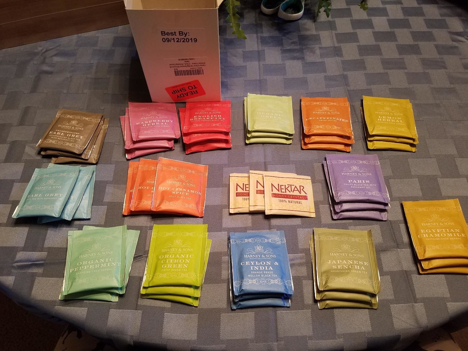 an assortment of teas laid out on a table 