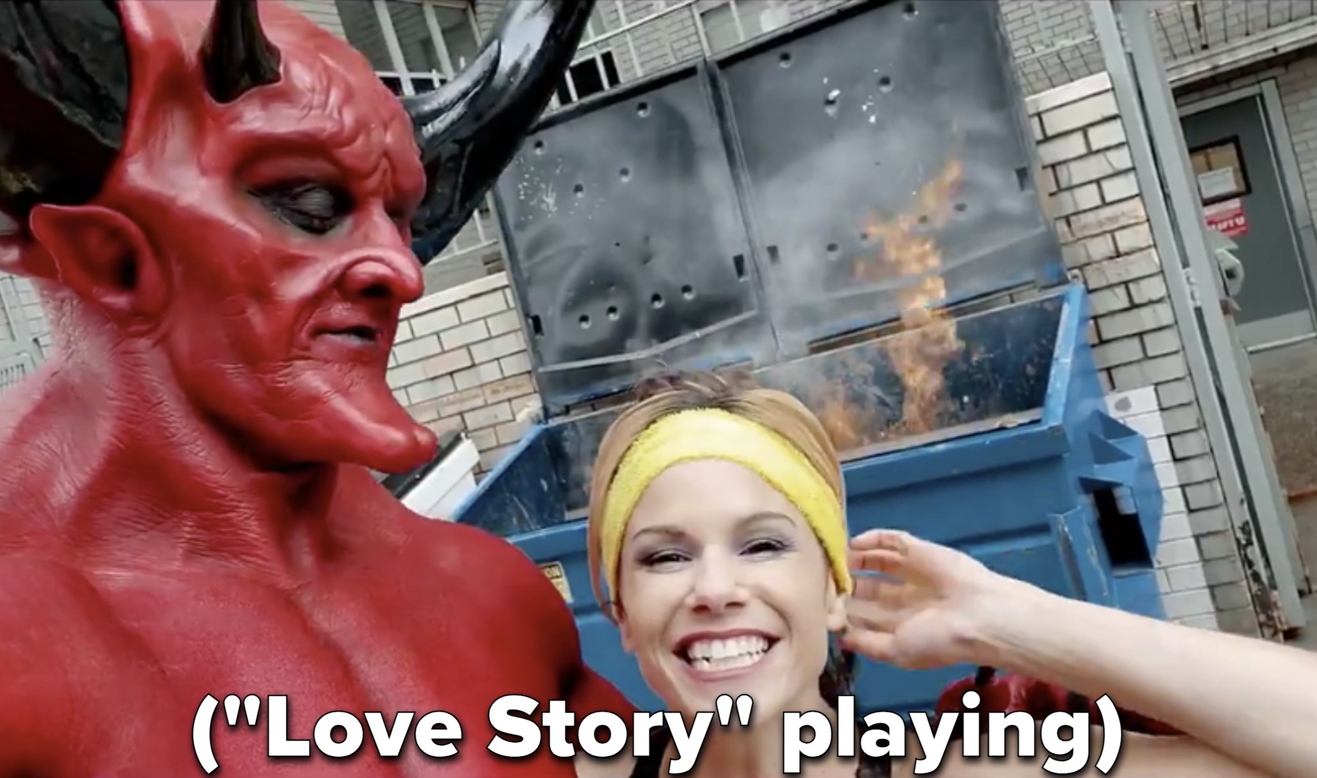 The Devil and 2020 pose in front of a dumpster fire while &quot;Love Story&quot; plays