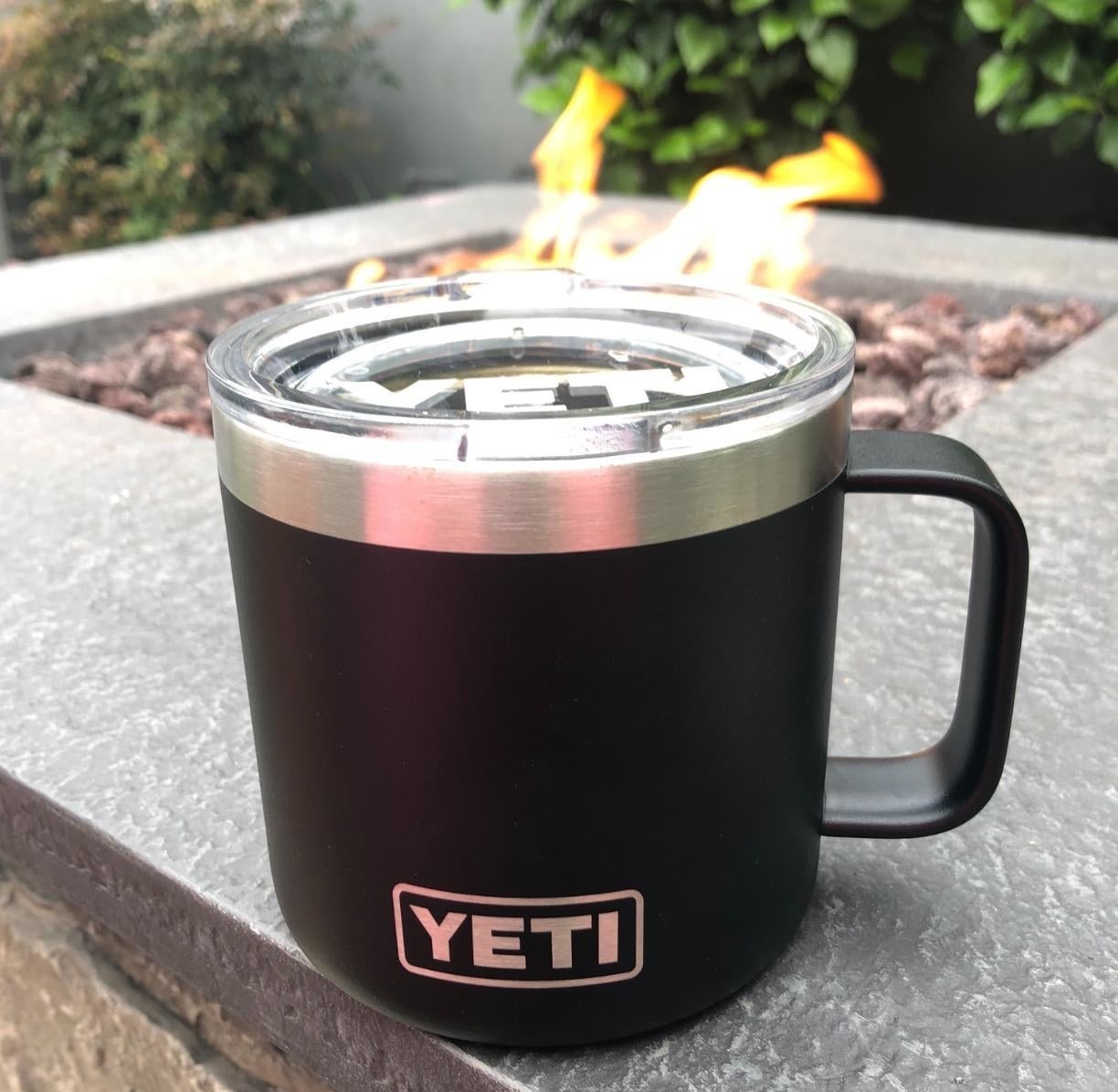 A black Yeti Rambler mug