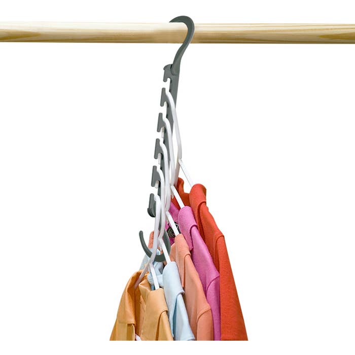 a wonder hanger organizer with five shirts on