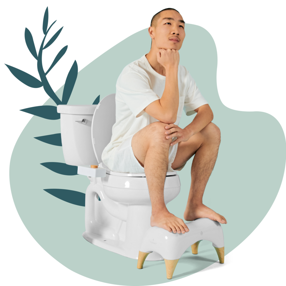Model sitting on a toilet with feet on the stool