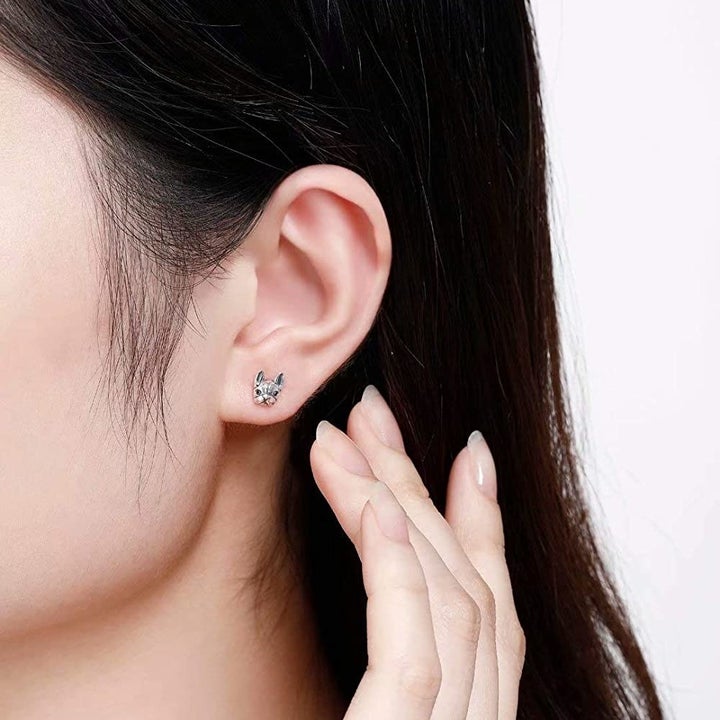 A model wearing one of the studs, which is very small