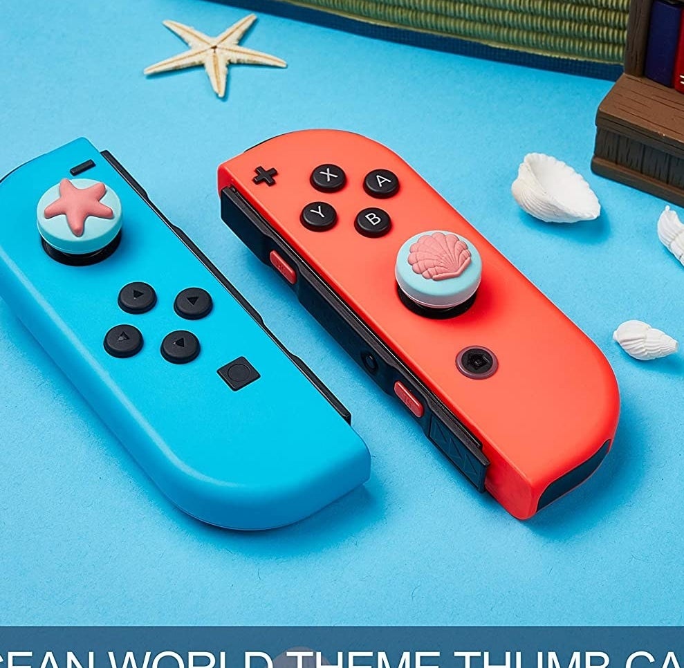 Two Joy-Cons with ocean-themed grips on them