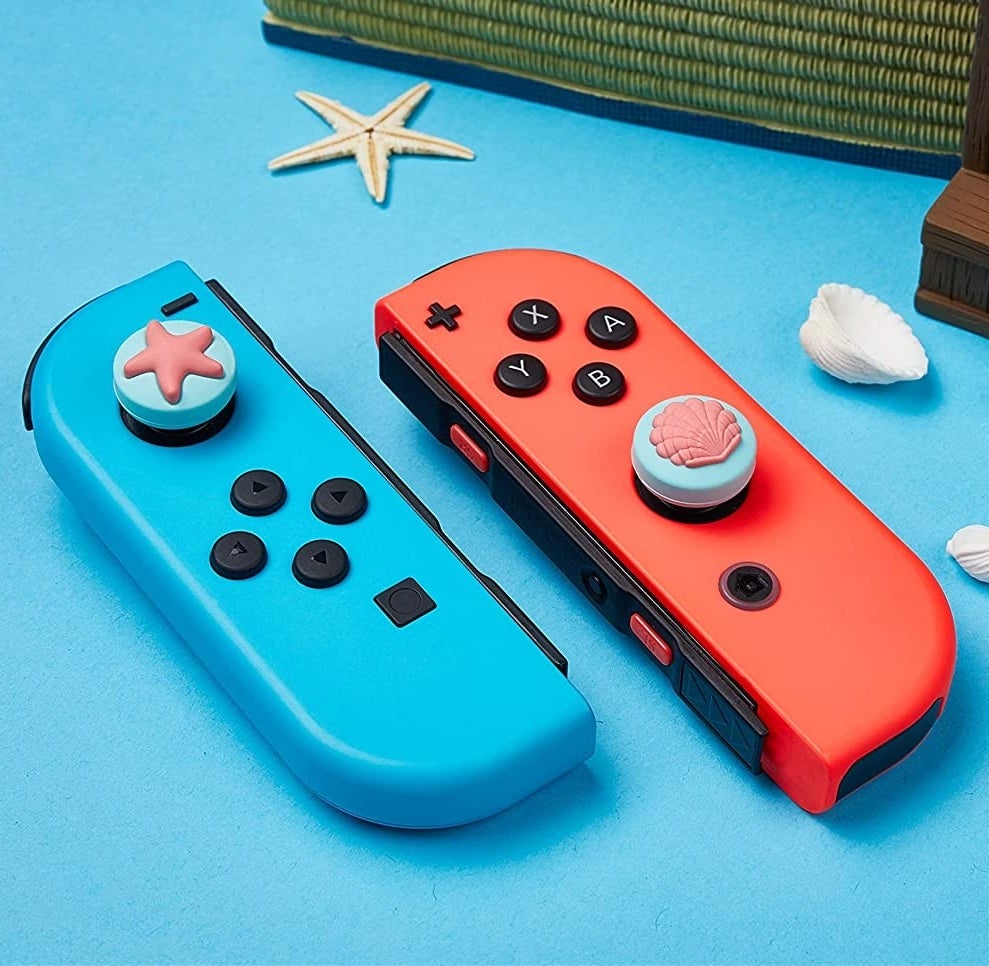 Two Joy-Cons with ocean-themed grips on them