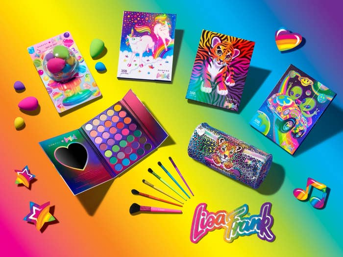 A product shot of the Lisa Frank makeup collection showing three palettes, brushes, and beauty blenders 