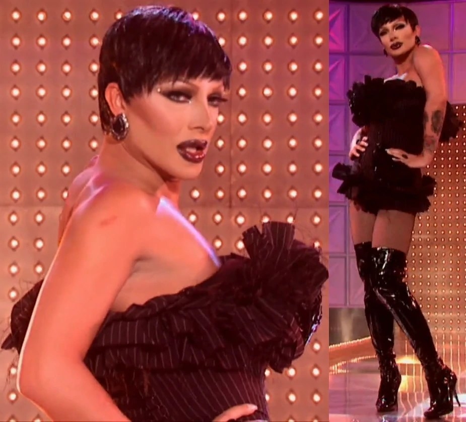Drag queen Raven wearing a black, pinstripe, frilly, corseted mini dress