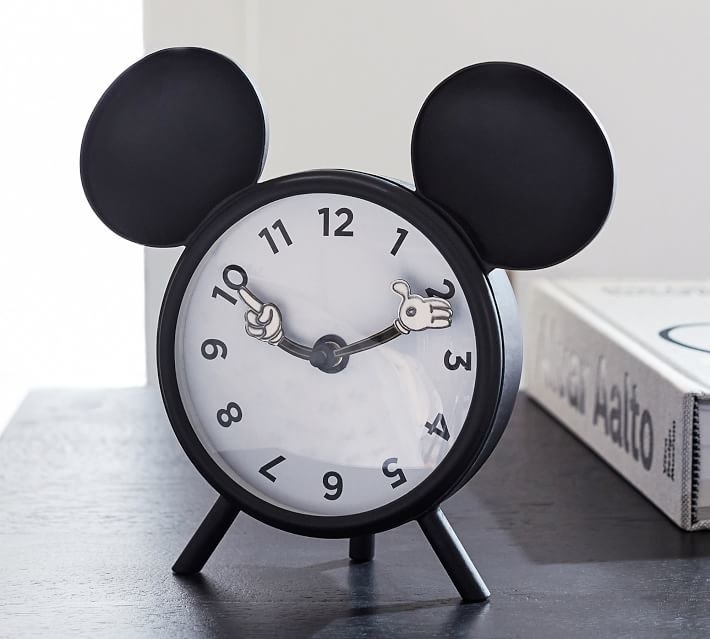a black alarm clock with mickey ears