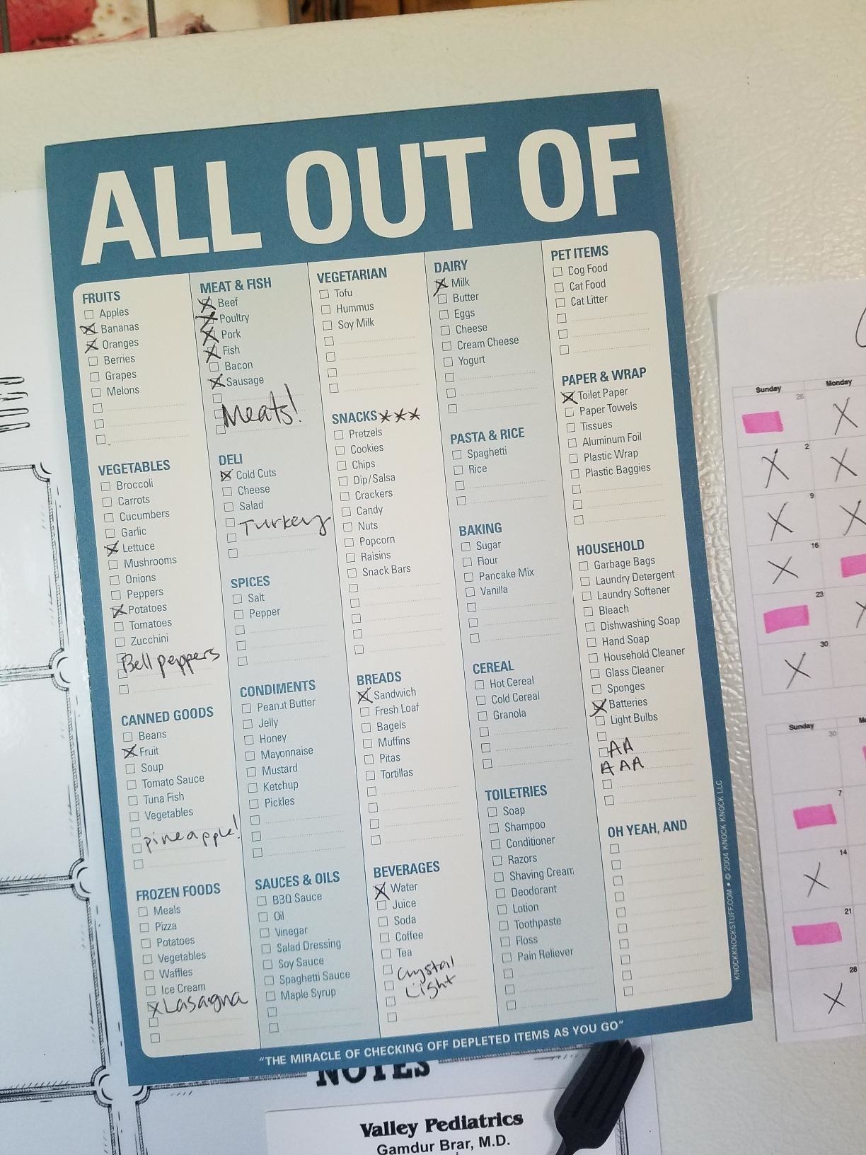 A reviewer photo of the pad with a header that reads &quot;All out of&quot; with notes and checkmarks on various items 