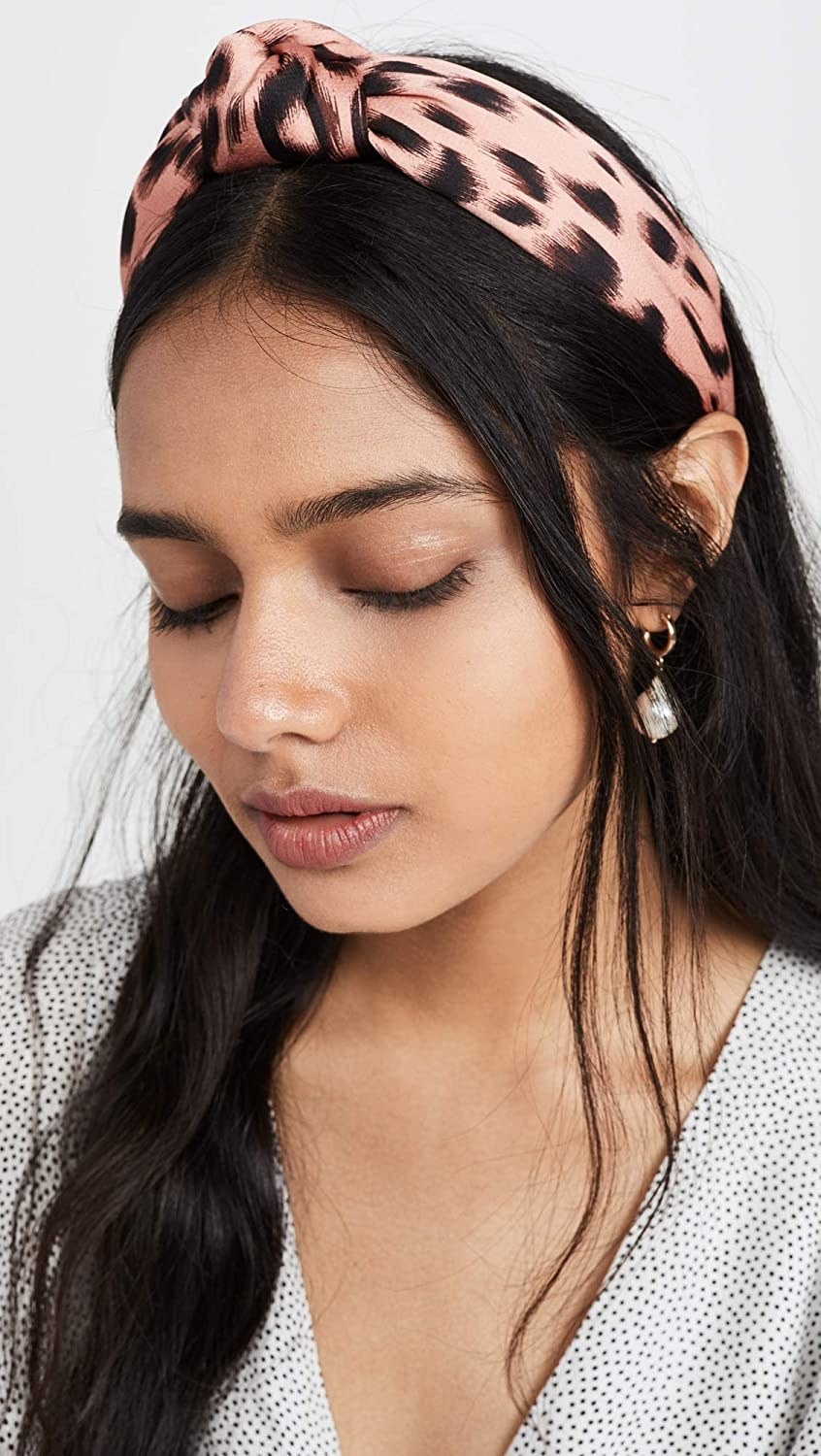 Model wearing the pink and black headband