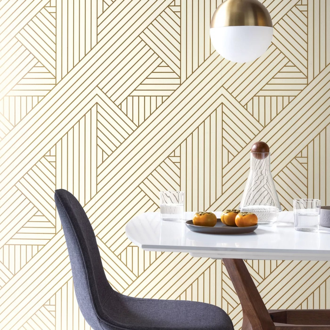 The wallpaper covering the wall of a dining room.