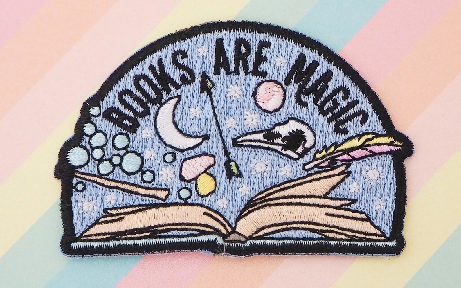 patch that reads books are magic with graphic 