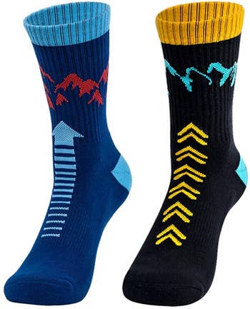 The two pack of socks showing the black and yellow pair with teal blue mountain design