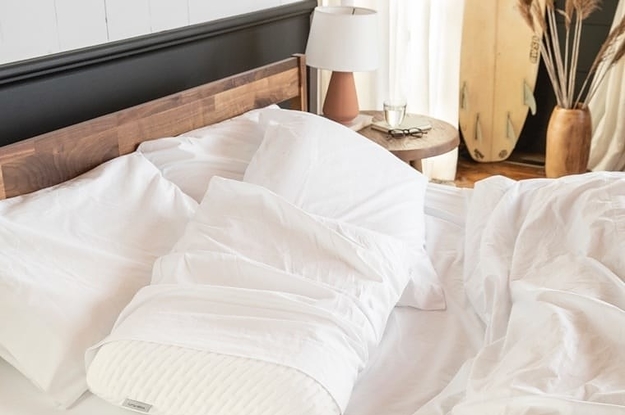 Pillows in white sheets on bed
