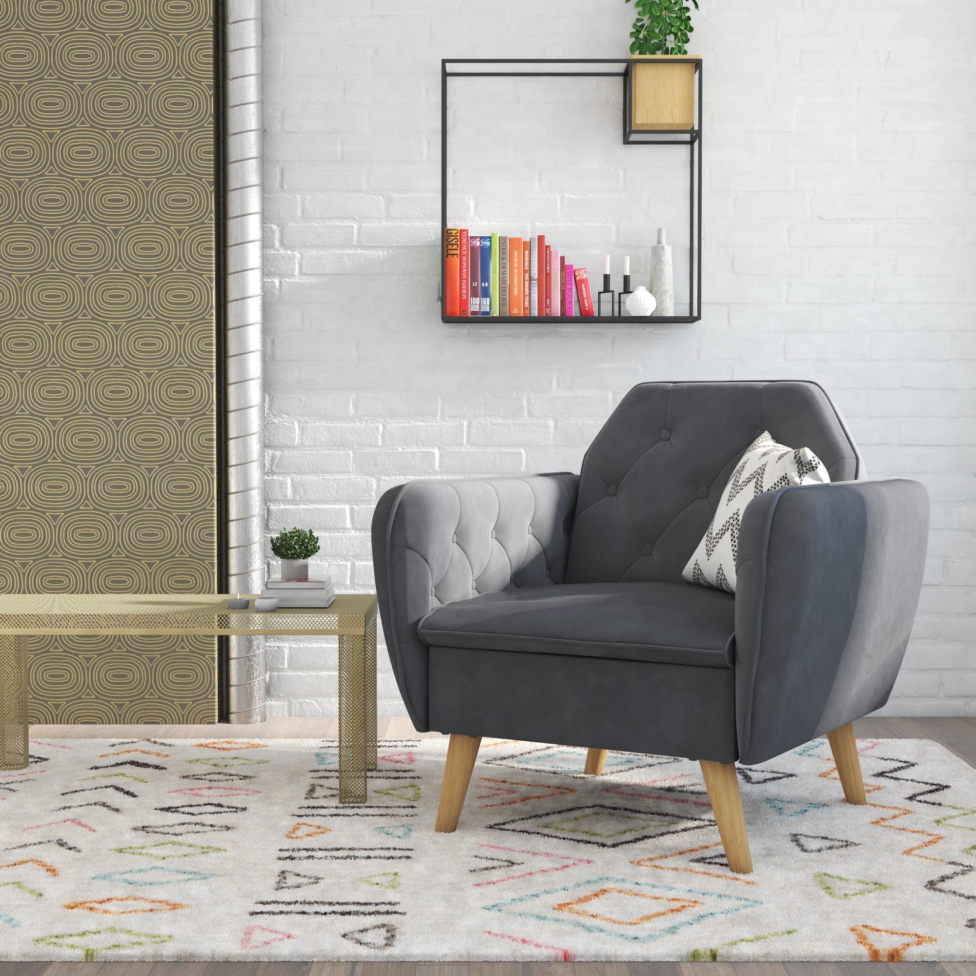 Rounded gray armchair with tufted buttons and wood legs