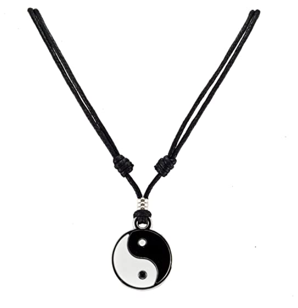 A black and white yin and yang pendant on a rope necklace 