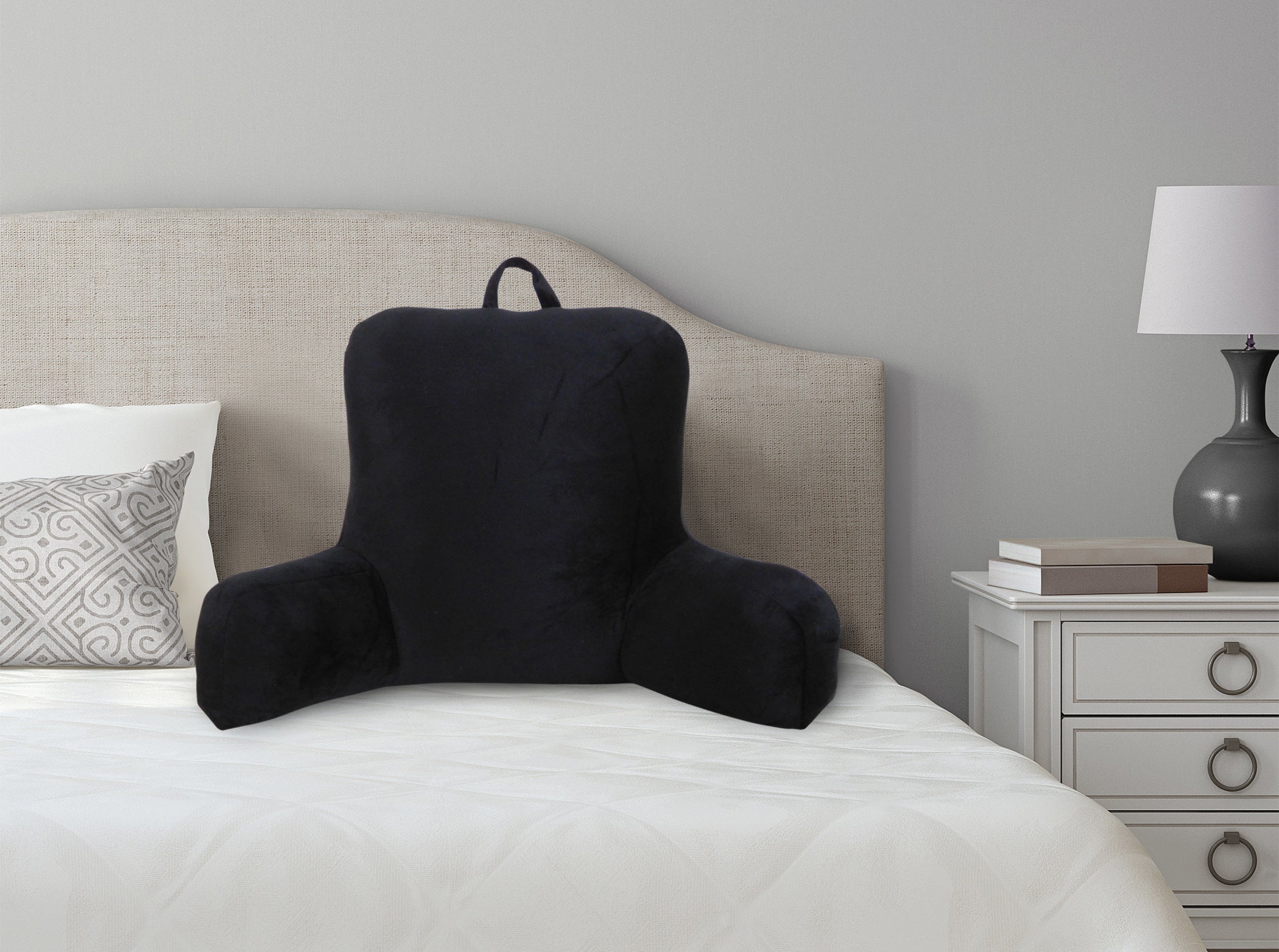 black lounger pillow on a bed