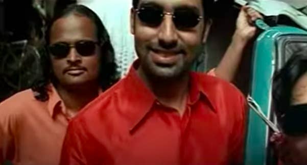 Abhishek bachchan smiles in a still from the movie yuva