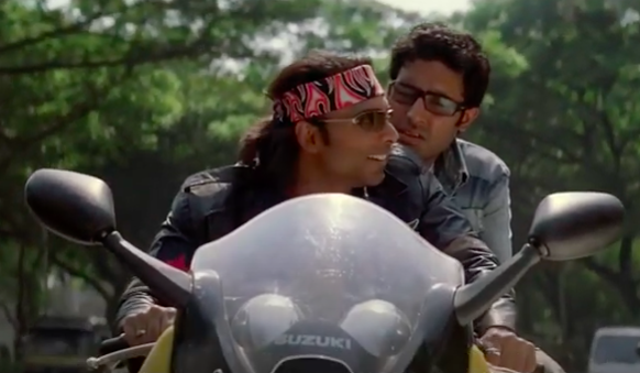 Abhishek bachchan and uday chopra have a conversation on a bike