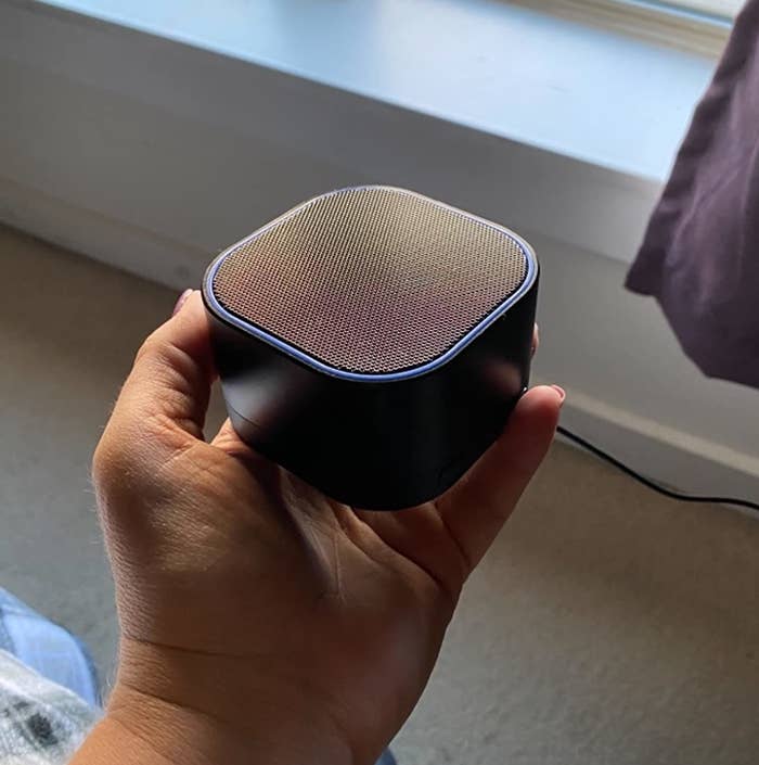 reviewer photo showing them holding the noise machine in their hand