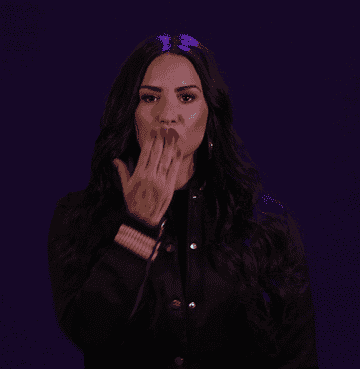 Demi blowing a kiss