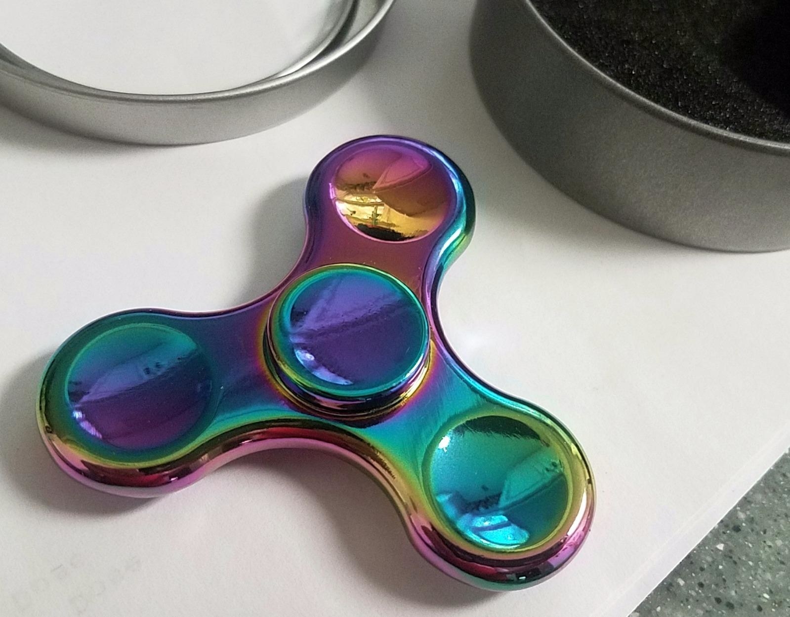 an iridescent fidget spinner