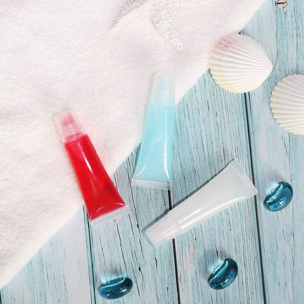 three tubes of lip gloss