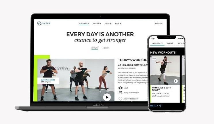 a workout class streaming on a laptop and a phone