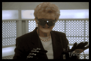 Gif of Angela Lansbury wearing a VR headset