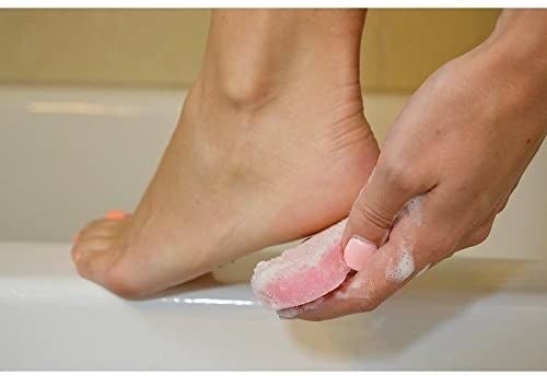A person scrubbing their foot with the buffer