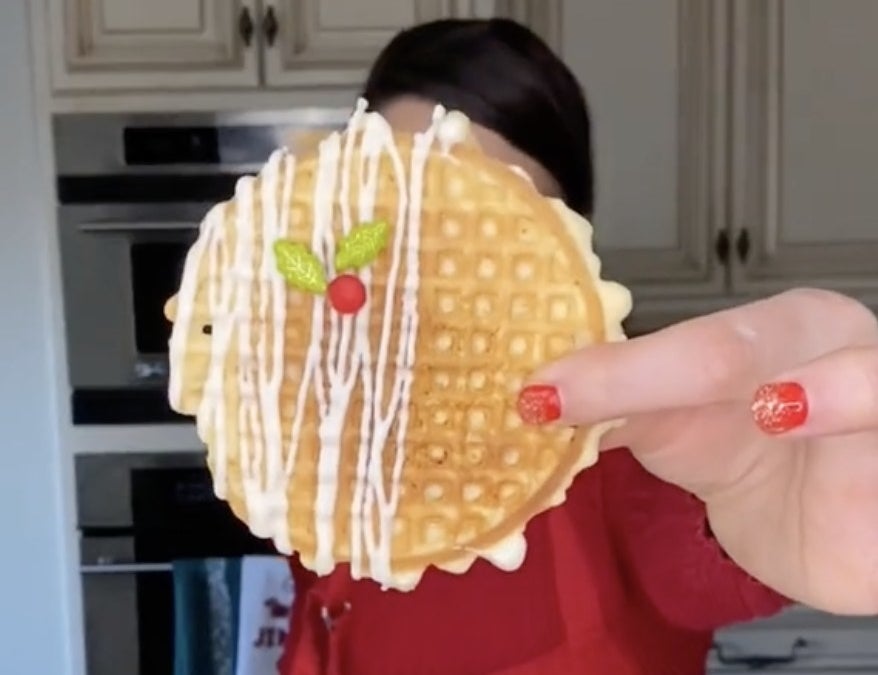 Cookies that look like thin waffles with white chocolate drizzle