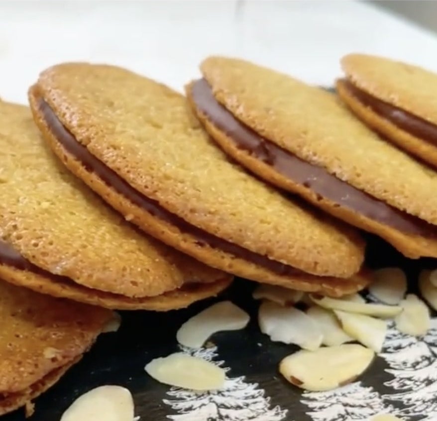 Golden cookies with chocolate in between