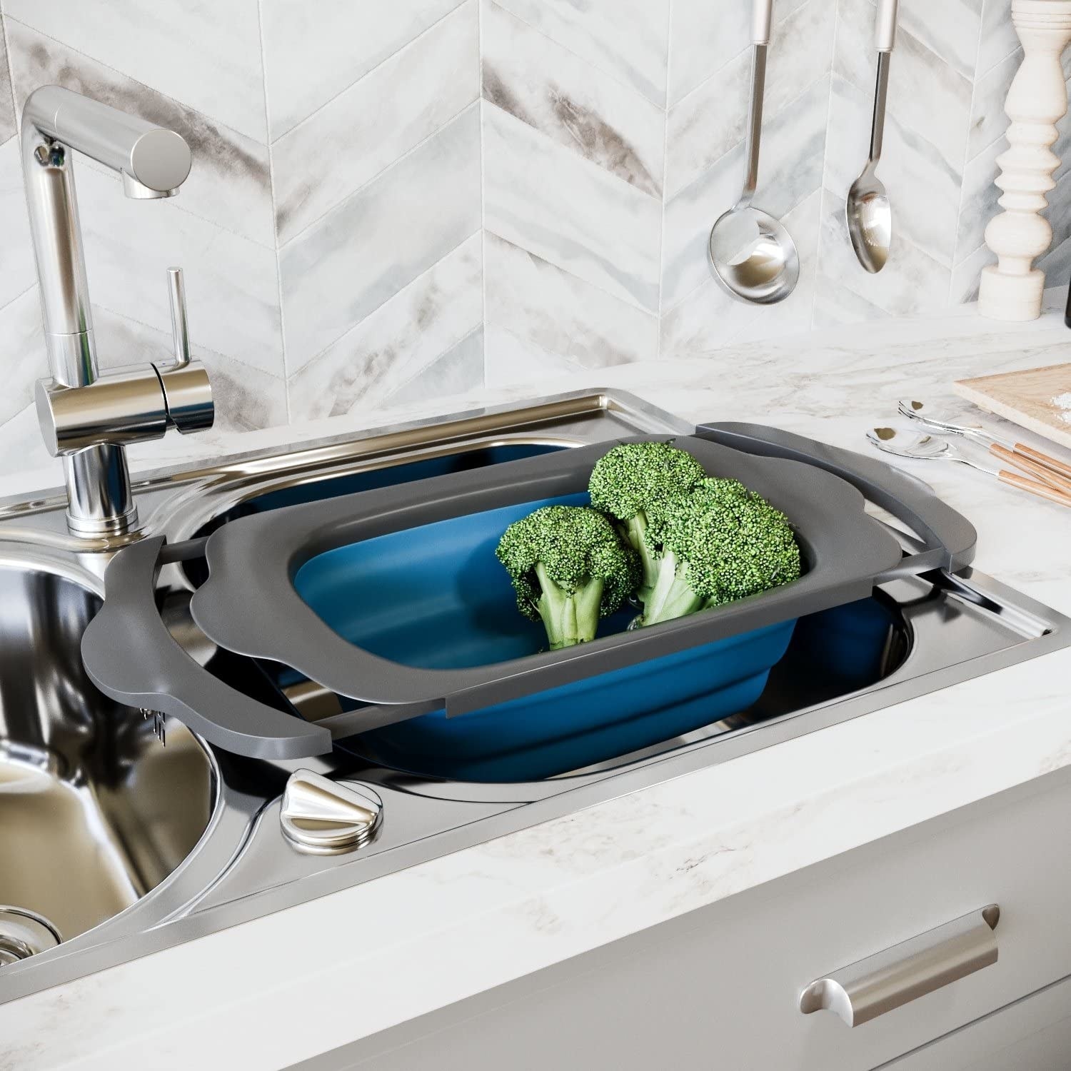 A colander with broccoli in it over a sink