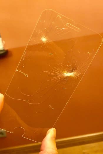 reviewer photo showing the shattered screen protector 