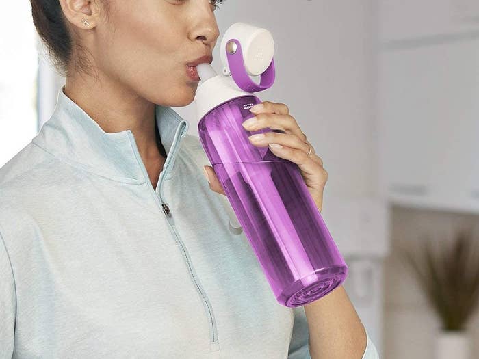 A person sipping from the Brita water bottle