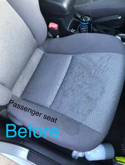 Fabric passenger seat of car with stains all over 
