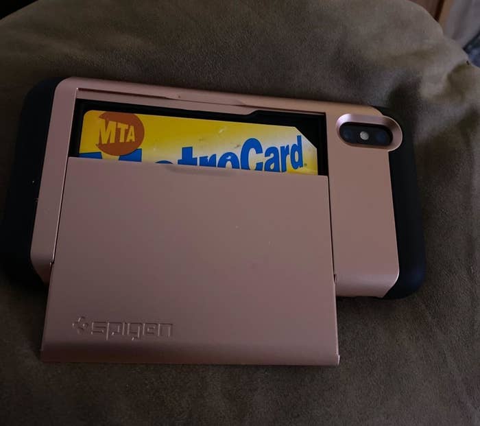 reviewer photo showing pink Spigen card case with metro card in it 