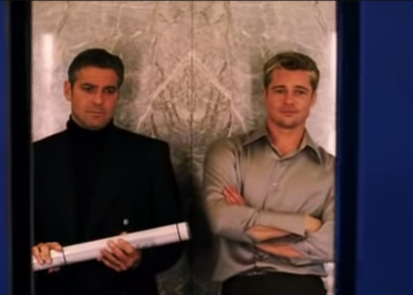 George Clooney as Danny Ocean and Brad Pitt as Robert "Rusty" Ryan in the movie "Ocean's Eleven."