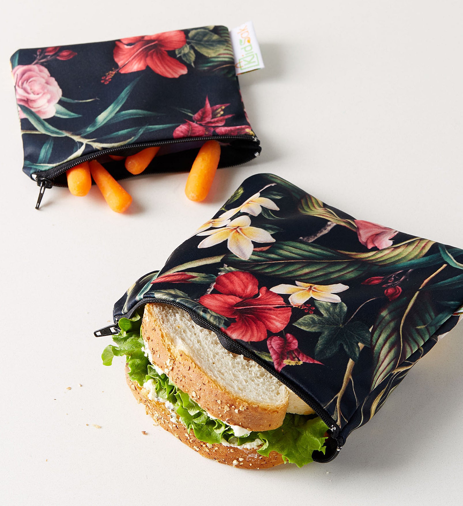 Two floral pouches with snacks inside