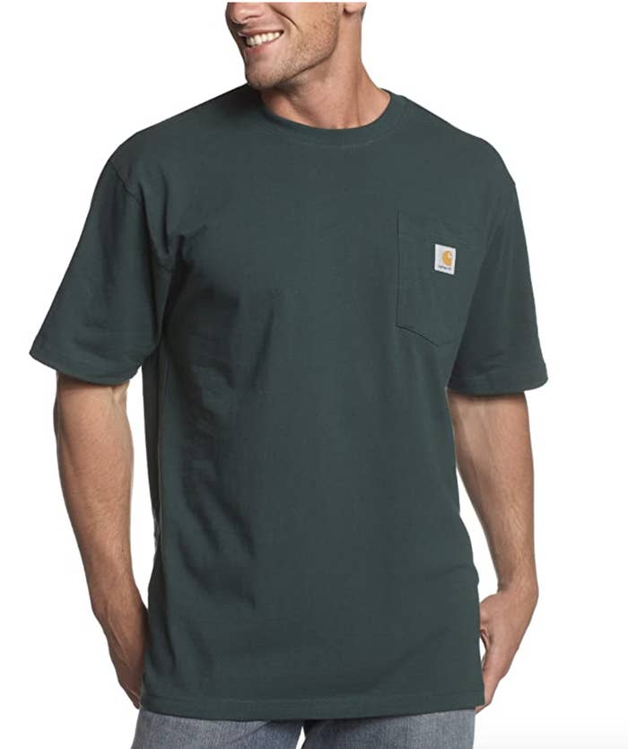 Model in a green t-shirt with a front left pocket 