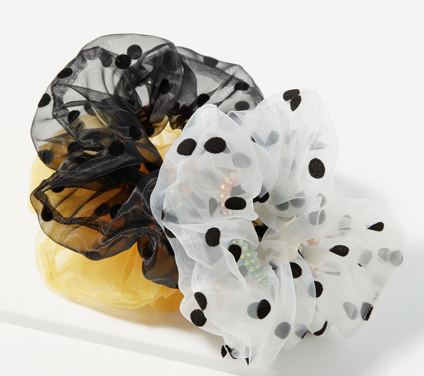 Three tulle scrunchies in a pile