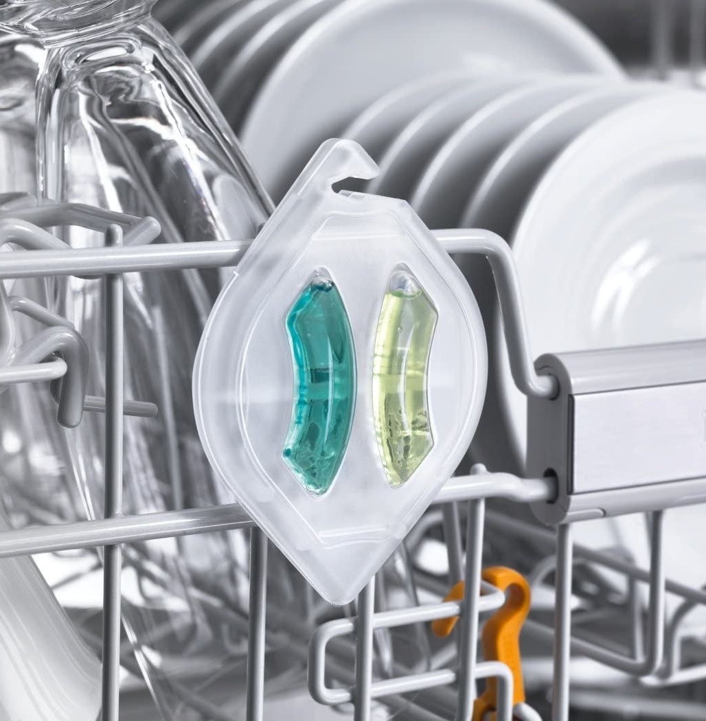 The dishwasher freshener clipped inside a dishwasher