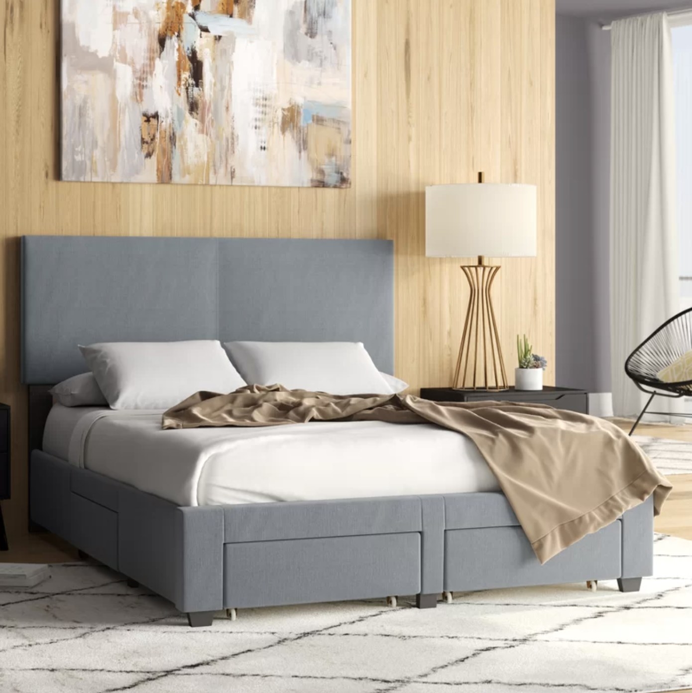 the bed frame in a gray color with three of the drawers displayed