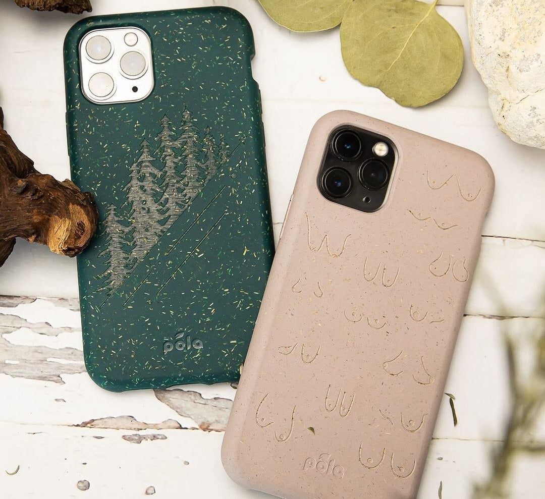 A green Pela iPhone case with a tree print and a tan Pela iPhone case with a boob print 
