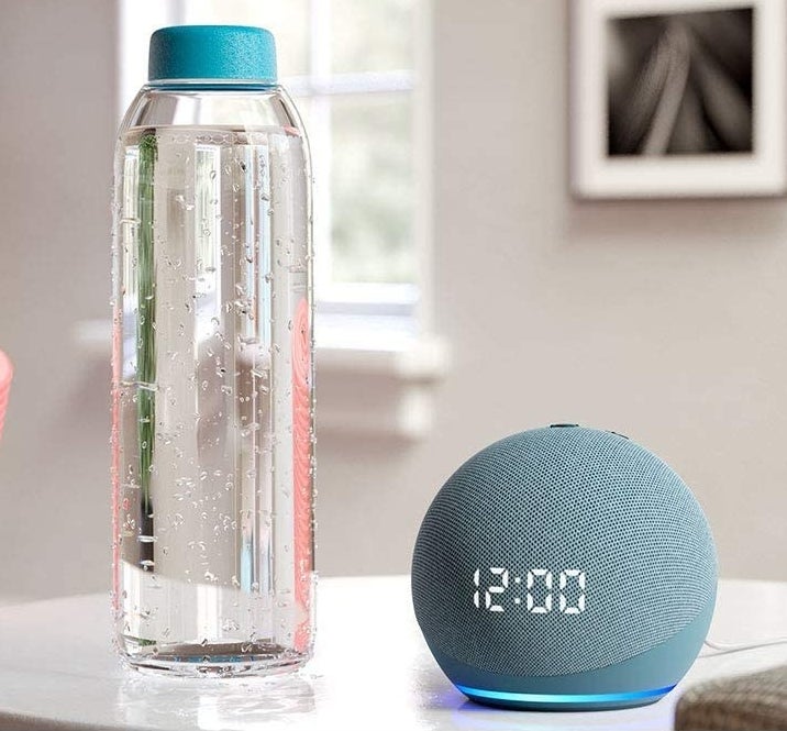 The Echo Dot next to a water bottle