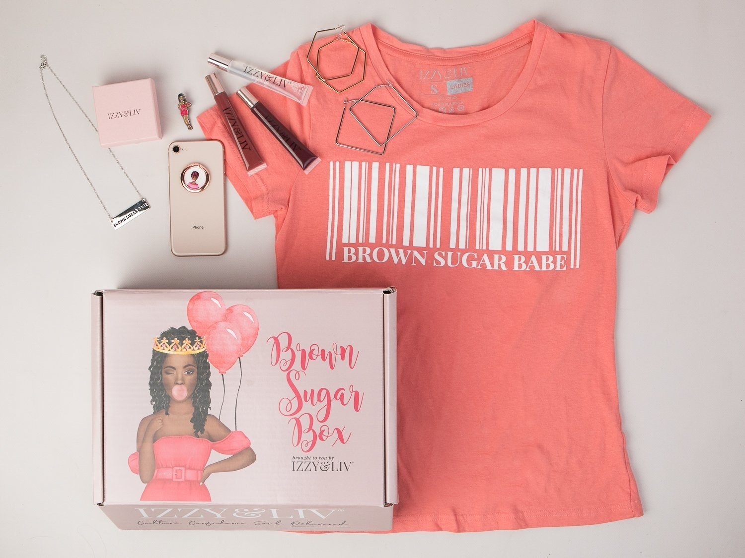 the box with a shirt that has a bar code on it and says &quot;Brown Sugar Babe&quot; with some jewelry and makeup