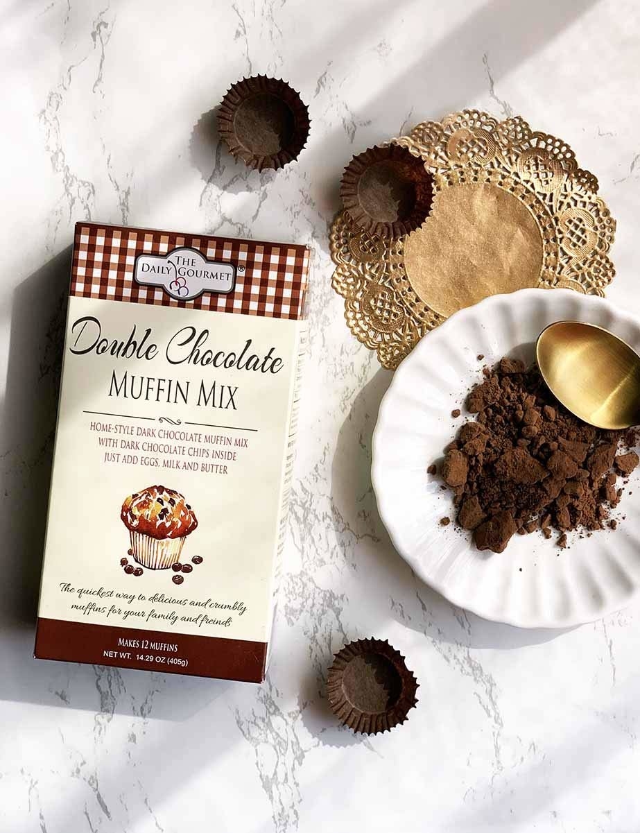 Double dark chocolate muffin mix next to muffin wrappers.