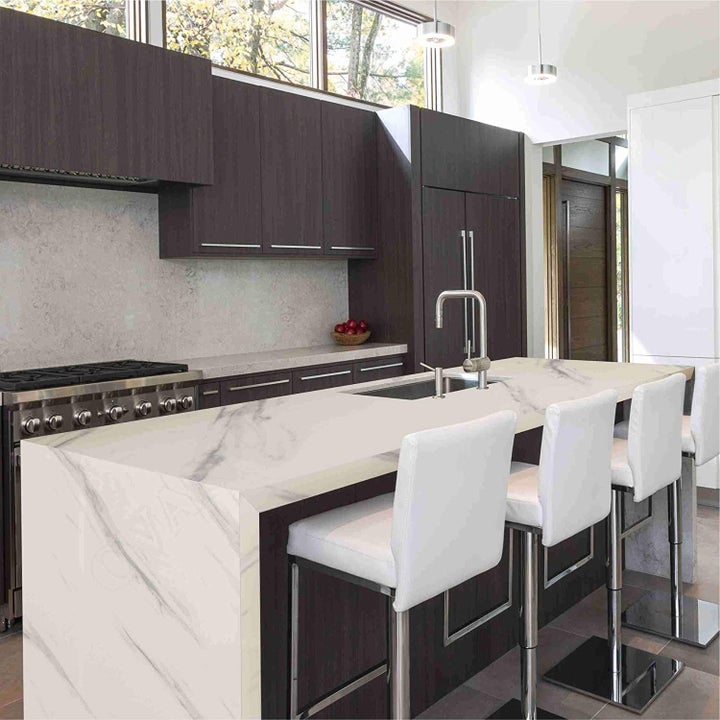 A kitchen counter covered with the white granite contact sheet.
