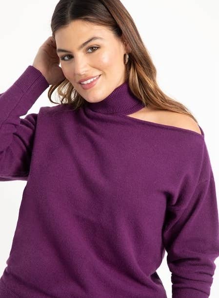 Model in high neck cold shoulder sweater