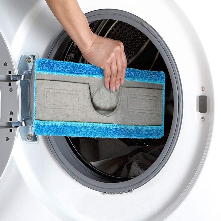 A model putting the microfiber pad in the washing machine 